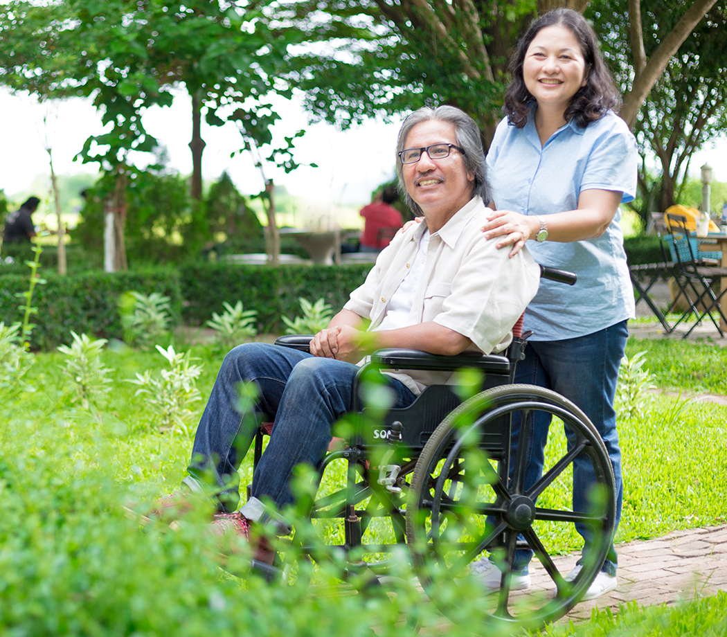 Male wheelchair user with his caregiver