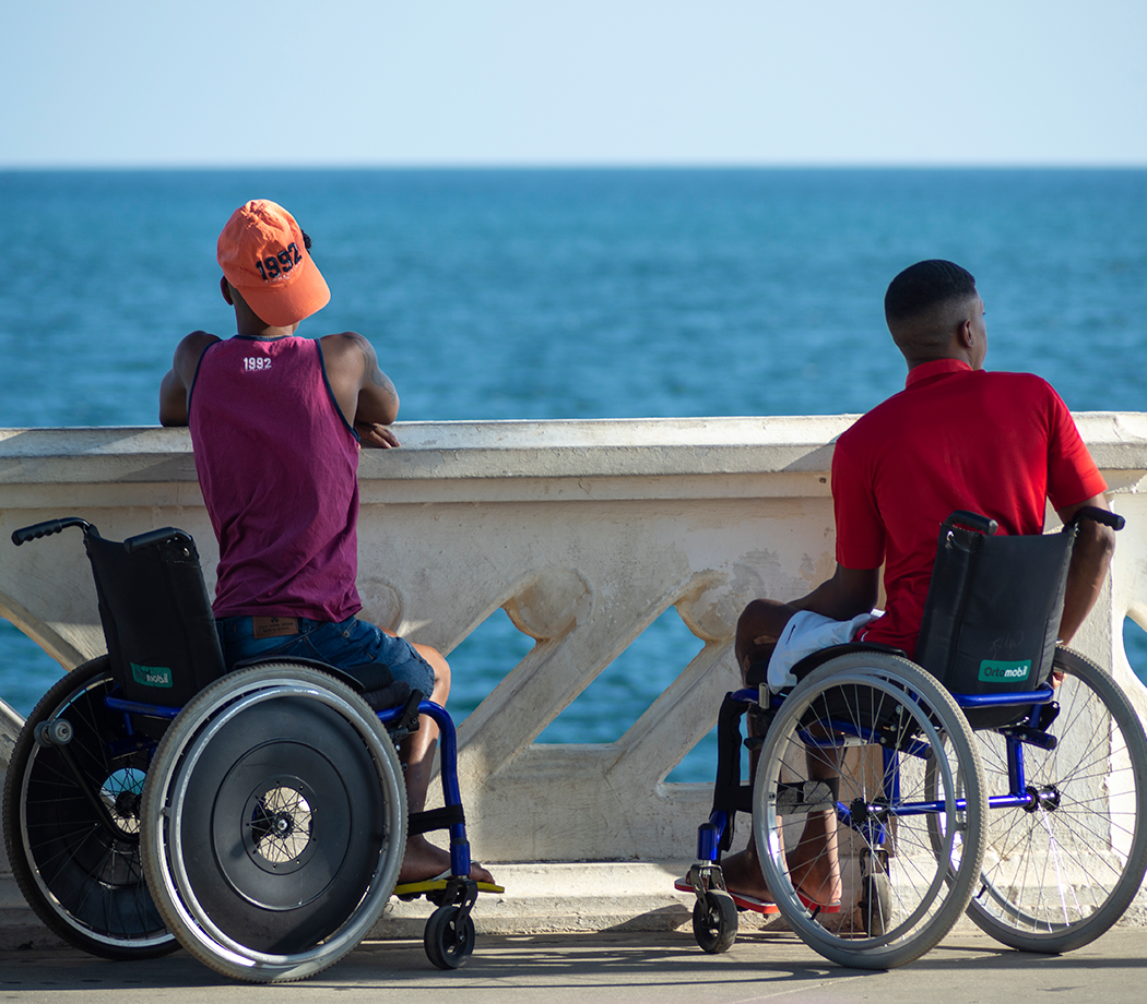 Two young people in wheelchairs enjoy the landscape