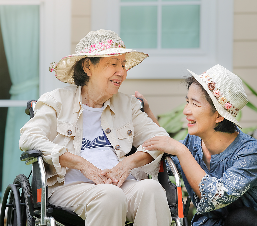 Caregiver with woman in a wheelchair