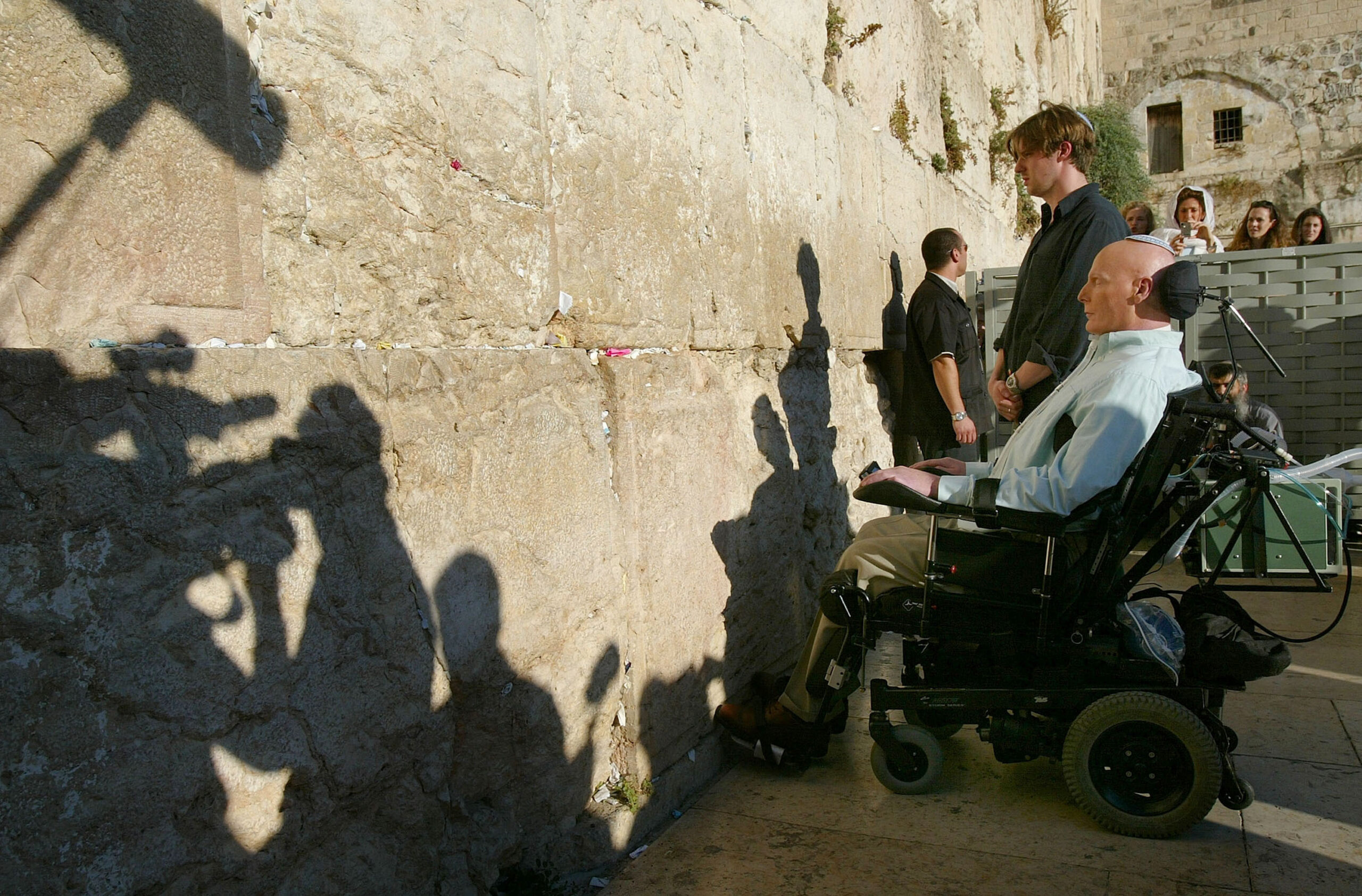REHOVOT, ISRAEL - JULY 30: (ISRAEL OUT) American actor Christopher Reeve prays with his son Matthew at the Western Wall, Judaism's holiest site, July 30, 2003 in Jerusalem's Old City, Israel. Reeve is in Israel to learn how the country treats cases of spinal cord injury and to promote stem cell research.